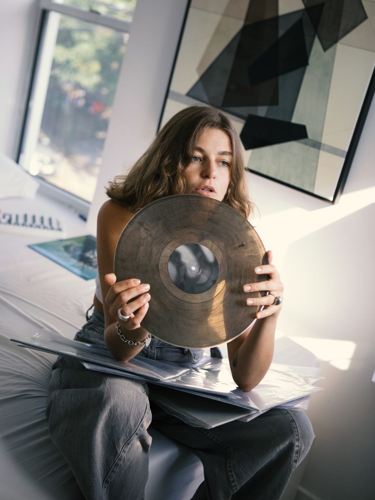 Camilla holding a vinyl record